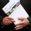 Chancellor of the Exchequer Alistair Darling holds a copy of his pre-budget report