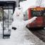 Snow chance: snowman waits in vain for a bus in icy Oxford