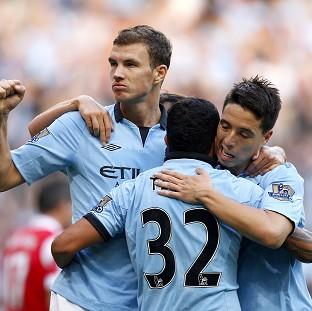 Edin Dzeko, left, bagged the winner for City