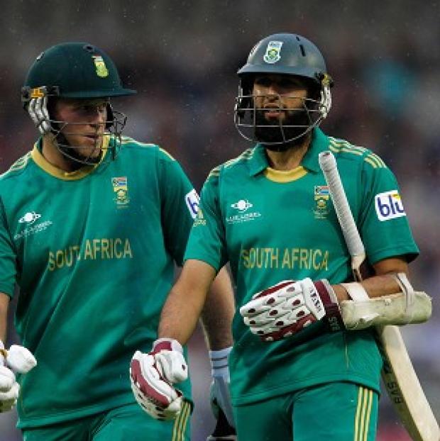 Congleton Guardian: Hashim Amla, right, hit an unbeaten 47 as South Africa finished 77-5 in a match reduced to nine overs per side Congleton Guardian: Hashim Amla, right, hit an unbeaten 47 as South Africa finished 77-5 in a match reduced to nine overs per side