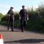 Police close to the scene in a lane in Ashill off the A358 near Ilminster, Somerset, after a young woman was discovered dead in a burning car