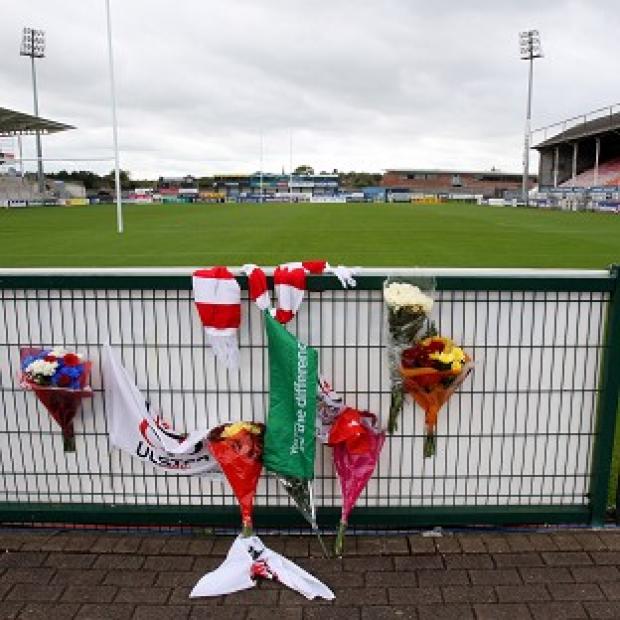 Flowers are laid at Ravenhill Ground in memory of Nevin Spence, who died on Saturday