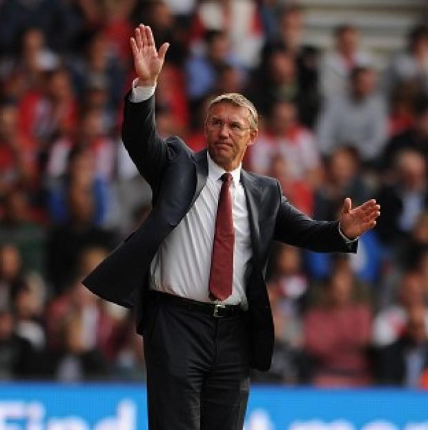 Southampton manager Nigel Adkins waves to the fans during the Barclays Premier League with Aston Villa