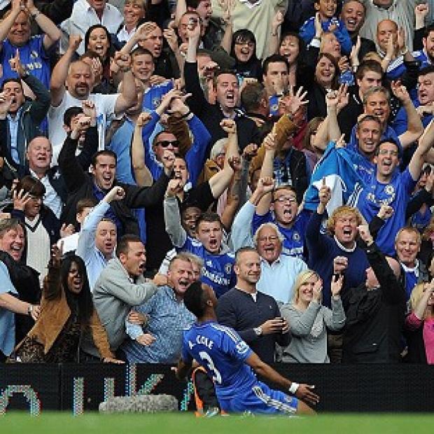 Ashley Cole celebrates his goal against Stoke