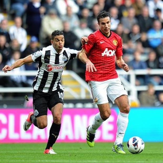Robin van Persie, right, and Hatem Ben Arfa battle for the ball in a full-blooded Tyneside clash