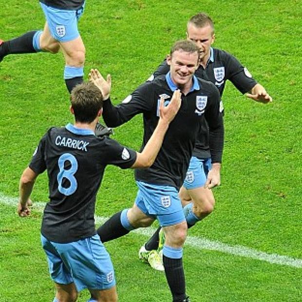 Wayne Rooney, centre, was on target as England recorded a draw in Poland