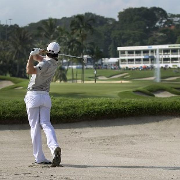 Rory McIlroy fired a closing 65 to climb the leaderboard on the final day of the Singapore Open (AP)