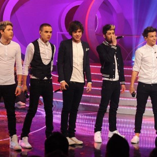 Pop heartthrobs One Direction did the double as they climbed straight to the summit of the singles and albums charts