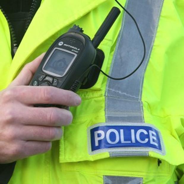 A police officer has died in a road accident while answering an emergency call