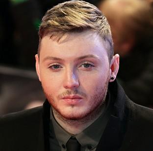 James Arthur's Impossible has remained at number one in the UK singles chart despite stiff competition