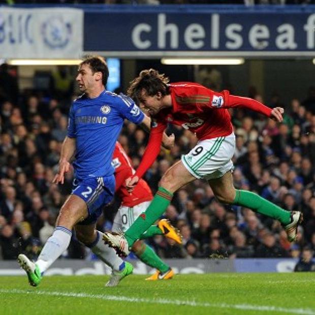 Michu, right, scored Swansea's opening goal of the game against Chelsea