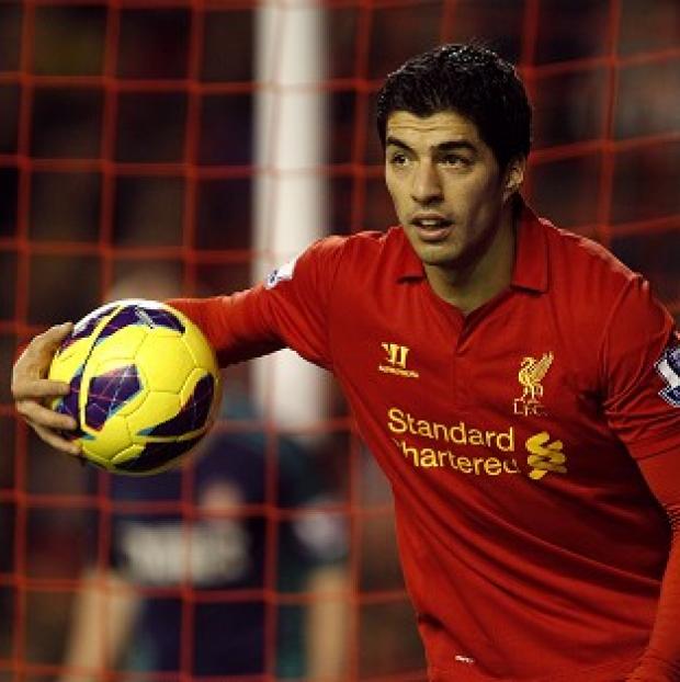Sir Alex Ferguson claims Liverpool's Luis Suarez, pictured, attracts controversy