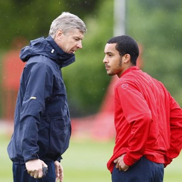 Manager Arsene Wenger, left, is confident Theo Walcott, right, will sign a new contract