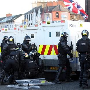A police officer is injured after loyalist protesters attacked police lines at the Albertbridge Road near the nationalist Short Strand area of Belfast