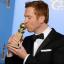 Damian Lewis kisses his award for best performance by an actor in a television series drama for Homeland (Jordan Strauss/Invision/AP)