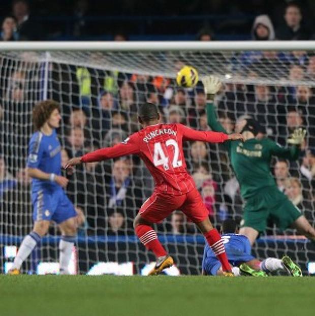 Jason Puncheon, centre, volleys home Southampton's equaliser to earn them a point