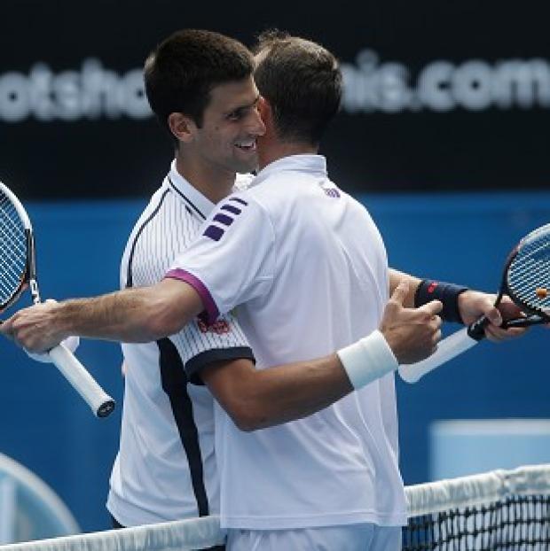 Novak Djokovic, left, is through to the fourth round in Melbourne (AP)