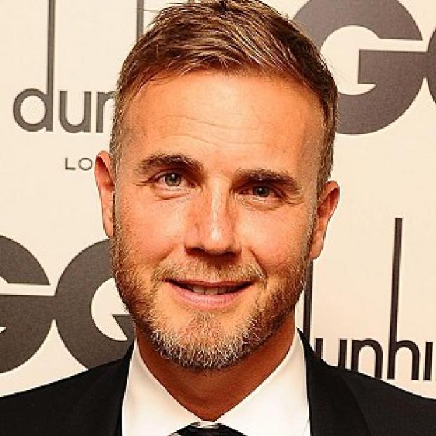 Romatic Gary Barlow serenaded the happy couple on stage