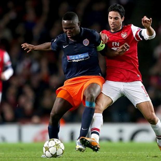 Mapou Yanga-Mbiwa, left, has signed for Newcastle for an undisclosed fee