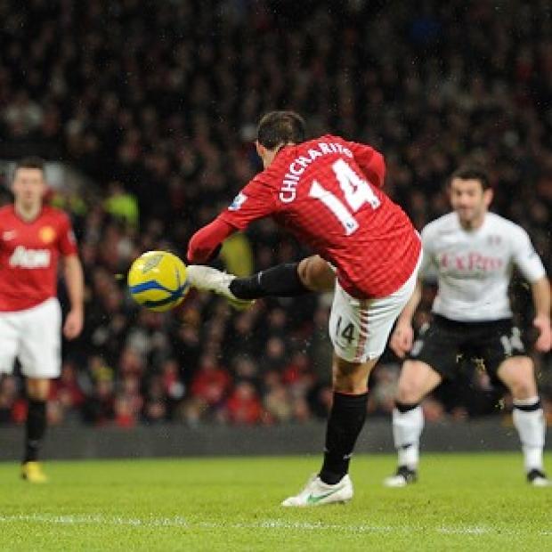 Javier Hernandez, centre, scores the first of his two goals for Manchester United against Fulham