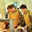 Prince Harry lining up at the self-service food section behind fellow Apache pilot Simon Beattie