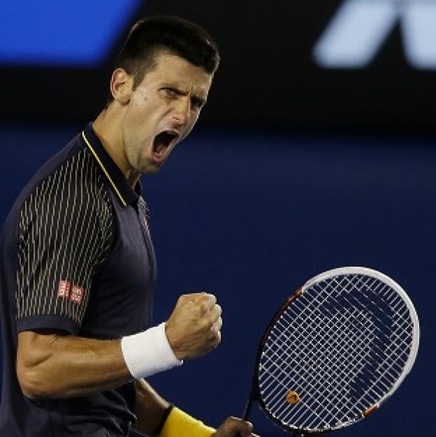 Novak Djokovic lets out a roar after winning the second set of the final (AP)
