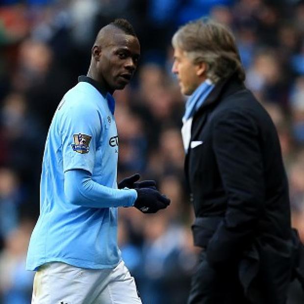 Congleton Guardian: Roberto Mancini, right, bade Mario Balotelli, left, farewell this week Congleton Guardian: Roberto Mancini, right, bade Mario Balotelli, left, farewell this week