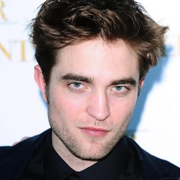 Robert Pattinson was apparently snapped riding a bike without a helmet