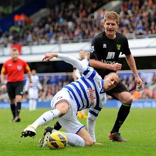 QPR's Bobby Zamora, left, and Norwich's Michael Turner battle for the ball during their goalless draw