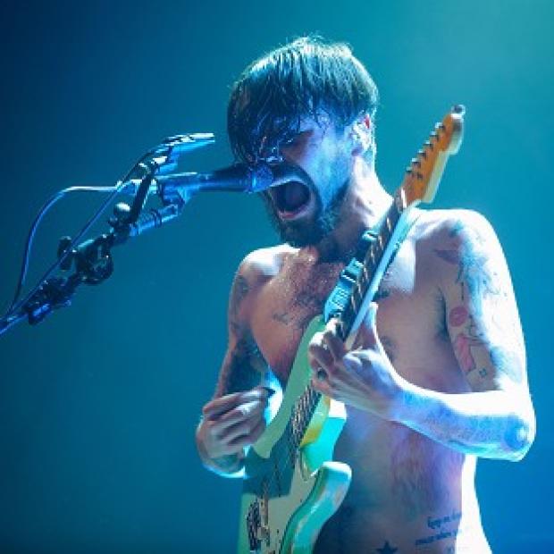 Congleton Guardian: Simon Neil of Biffy Clyro, who have scored their first number one album with Opposites, the Official Charts Company said Congleton Guardian: Simon Neil of Biffy Clyro, who have scored their first number one album with Opposites, the Official Charts Company said