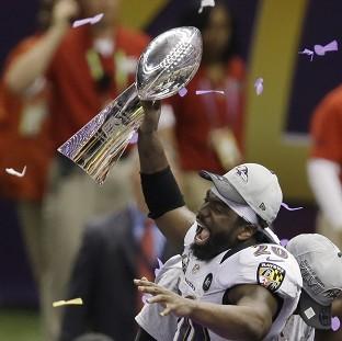 Baltimore Ravens safety Ed Reed holds the Vince Lombardi Trophy (AP)