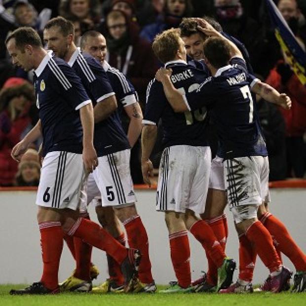 Scotland's players celebrate their opening goal, scored by Charlie Mulgrew, against Estonia