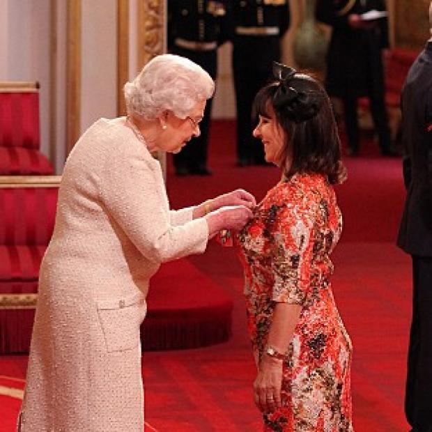Arlene Phillips received a CBE from the Queen
