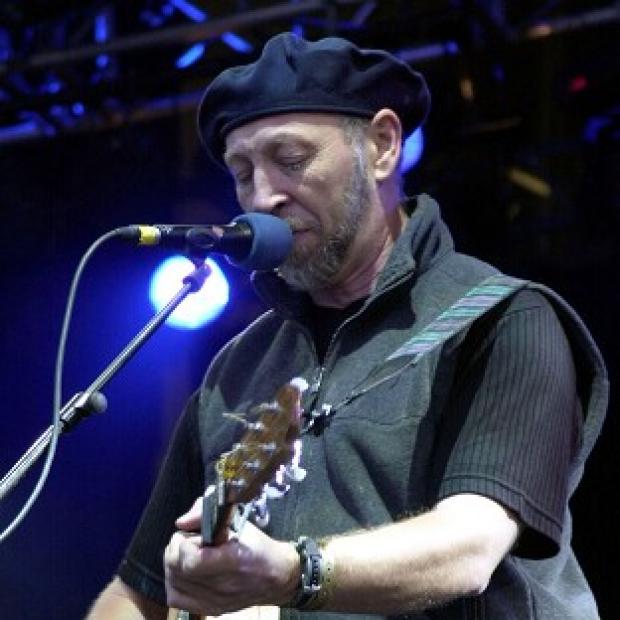 Folk rock guitarist and singer songwriter Richard Thompson performing on stage
