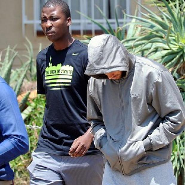 South Africa police say Oscar Pistorius, right, will appear in court on Friday (AP)