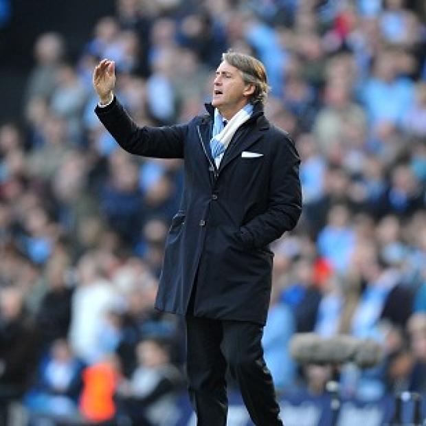 Manchester City boss Roberto Mancini, pictured, reserved special praise for two-goal man Sergio Aguero