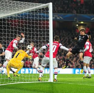 Thomas Muller, right, was on target with Bayern Munich's second goal in the victory over Arsenal