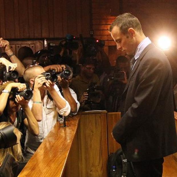 Congleton Guardian: Oscar Pistorius stands in the dock during his bail hearing in Pretoria (AP) Congleton Guardian: Oscar Pistorius stands in the dock during his bail hearing in Pretoria (AP)