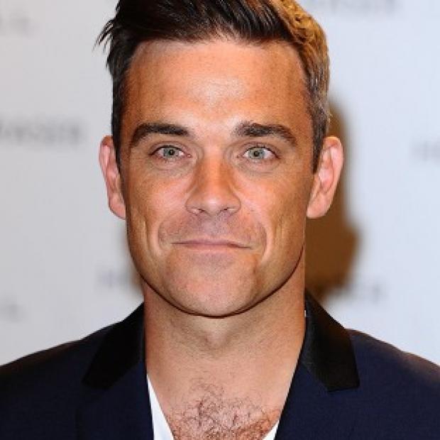 Robbie Williams has been in the studio with Guy Chambers