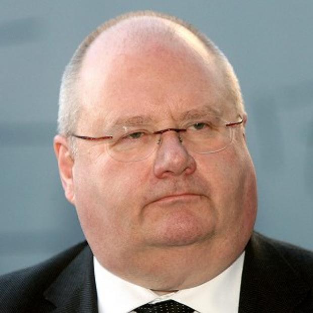 Eric Pickles faces a significant revolt by town halls over council tax, a survey shows