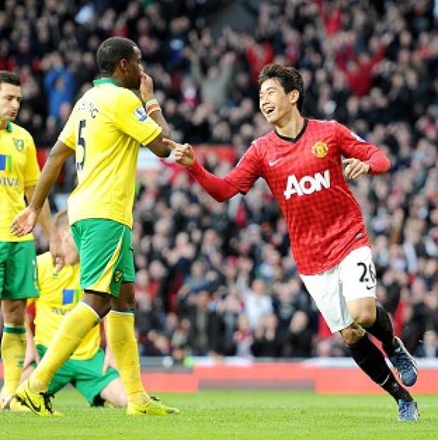 Shinji Kagawa, right, bagged a hat-trick as Manchester United eased past Norwich