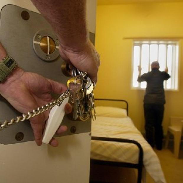 Reoffending could rise because of cuts to prisoner management services, an influential committee of MPs said