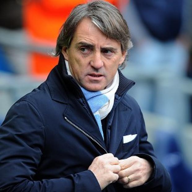 Roberto Mancini's Manchester City sit 12 points behind neighbours United in the Barclays Premier League
