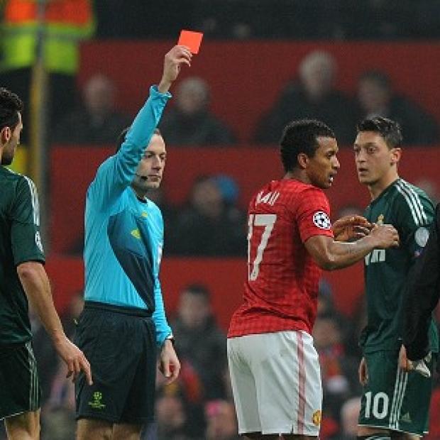 Nani, second right, was sent off by referee Cuneyt Cakir, left, following a high tackle