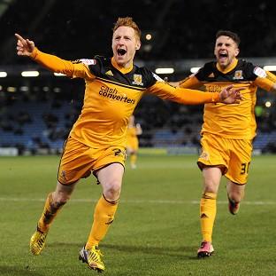 Stephen Quinn, left, celebrates scoring Hull's winner against Burnley