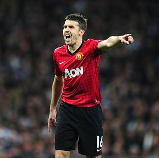 Rio Ferdinand feels Michael Carrick, pictured, has handled extra responsibility 'superbly'
