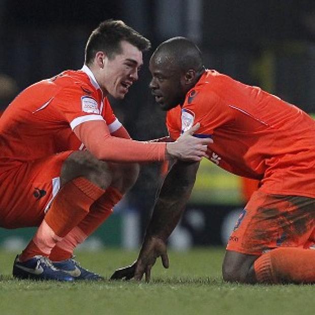 Millwall will focus on the league after Danny Shittu, right, headed them into the semi-finals