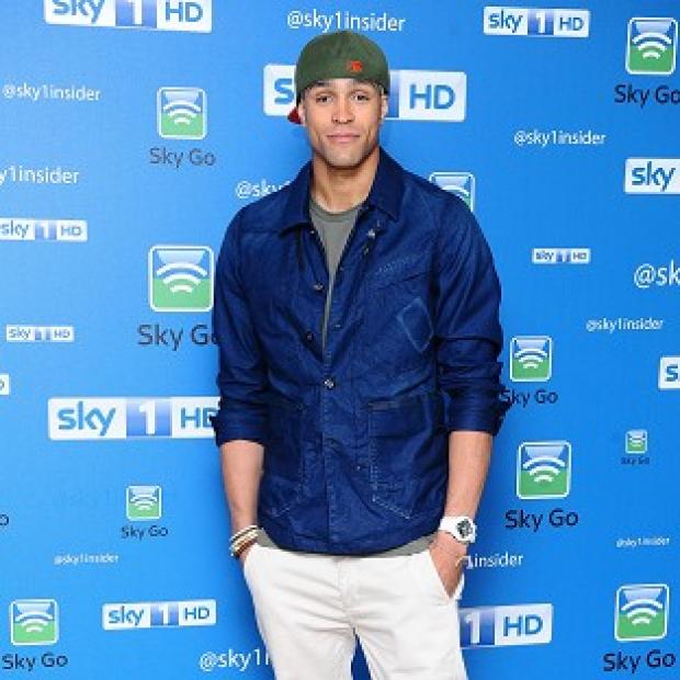 Ashley Banjo wears his hat when he goes swimming