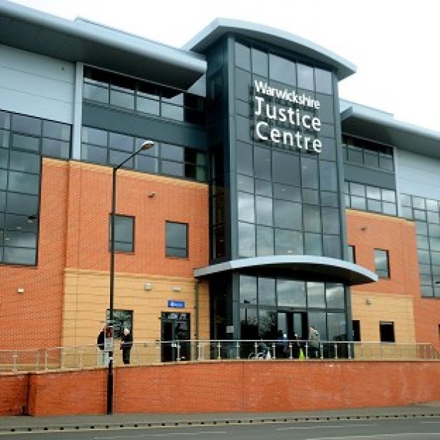 More than 60 people are being held by police at the Warwickshire Justice Centre in Nuneaton after disorder in the town centre