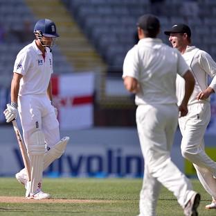 England's Alastair Cook leaves the field after being caught by New Zealand's BJ Watling off Trent Boult